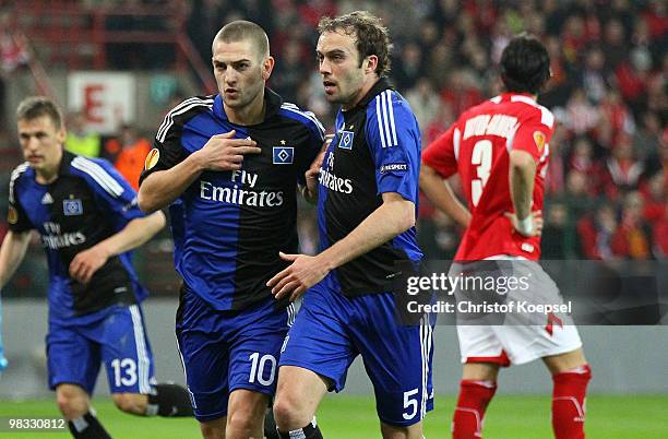 Mladen Petric of Hamburg celebrates the first goal with Joris Mathijsen of Hamburg during the UEFA Europa League quarter final second leg match...