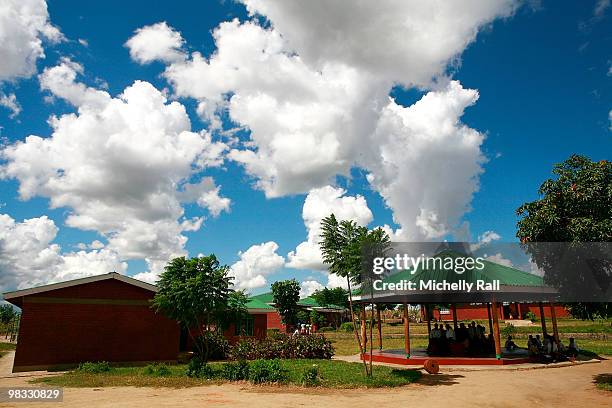 Madonna's Tour of one of the Raising Malawi initiative's - Mphandula Childcare Centre which supports over 350 Children from the surrounding Namitete...