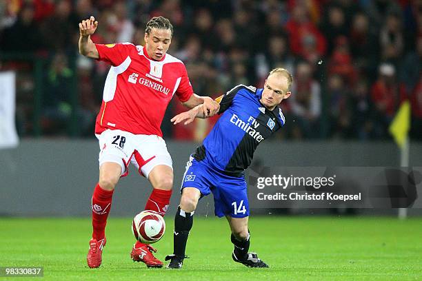 David Jarolim of Hamburg challenges Axel Witsel of Liege during the UEFA Europa League quarter final second leg match between Standard Liege and...