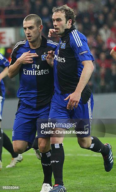 Mladen Petric of Hamburg celebrates the first goal with Joris Mathijsen of Hamburg during the UEFA Europa League quarter final second leg match...