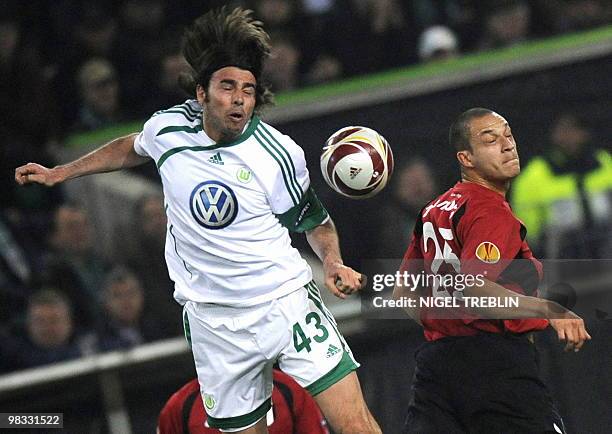 Wolfsburg's Italian defender Andrea Barzagli and Fulham's forward Bobby Zamora vie for the ball during the UEFA Europa League second leg...