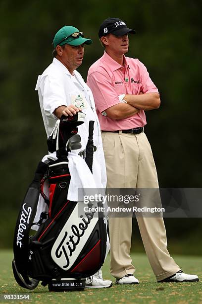 Steve Stricker waits with his caddie Jimmy Johnson on the fifth hole during the first round of the 2010 Masters Tournament at Augusta National Golf...