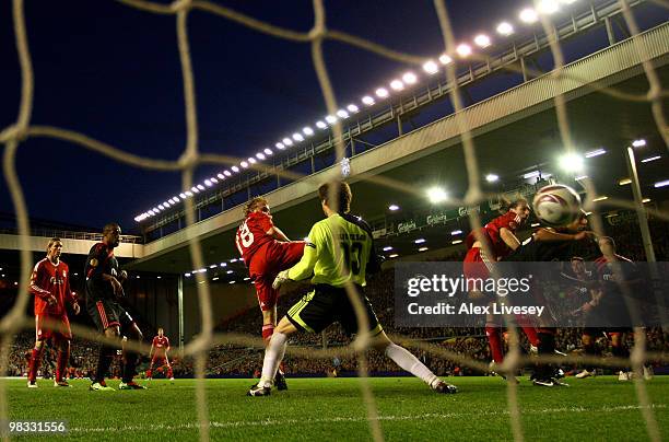 Dirk Kuyt of Liverpool scores the opening goal past Julio Cesar of Benfica during the UEFA Europa League Quarter Final second leg match between...