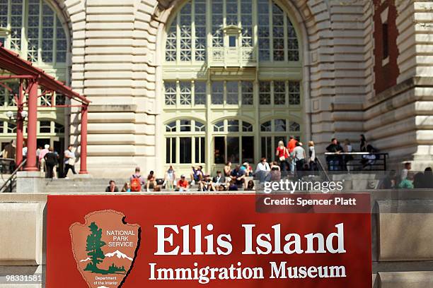 Visitors to Ellis Island mingle outside the entrance on April 8, 2010 in New York, New York. The nonprofit in charge of restoring Ellis Island, the...