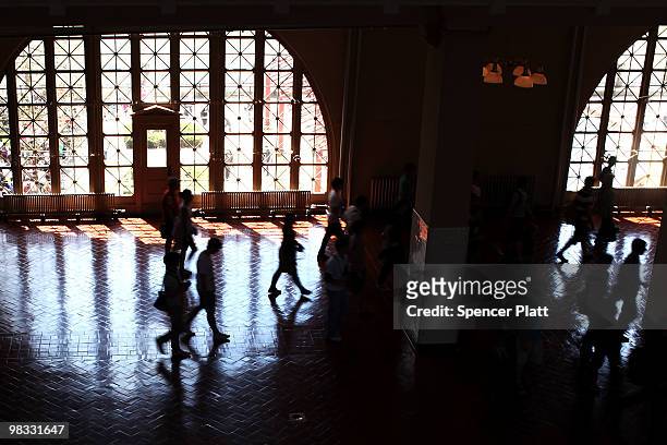 Visitors to Ellis Island walk through the registry hall, now part of a museum on the island, on April 8, 2010 in New York, New York. The nonprofit in...
