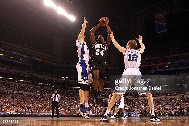 Avery Jukes of the Butler Bulldogs attempts a shot in the first half against Brian Zoubek and Kyle Singler of the Duke Blue Devils during the 2010...