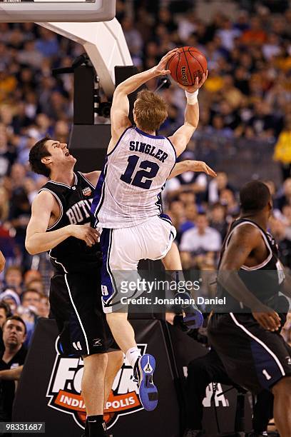 Kyle Singler of the Duke Blue Devils drives for a shot attempt against Andrew Smith of the Butler Bulldogs during the 2010 NCAA Division I Men's...