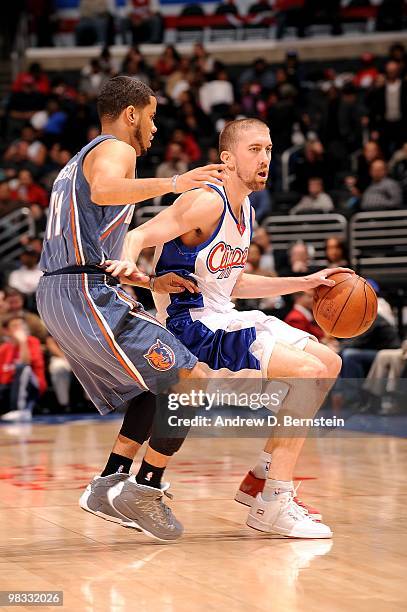 Steve Blake of the Los Angeles Clippers goes up against D.J. Augustin of the Charlotte Bobcats during the game on February 22, 2010 at Staples Center...