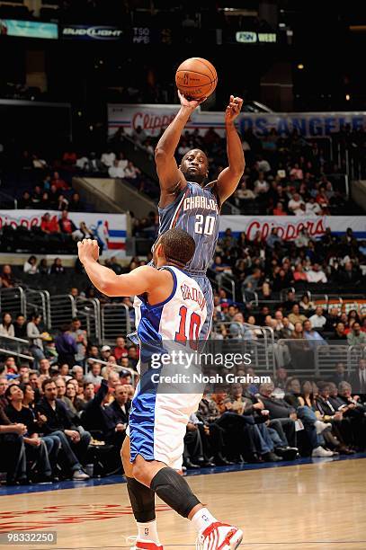 Raymond Felton of the Charlotte Bobcats shoots over Eric Gordon of the Los Angeles Clippers during the game on February 22, 2010 at Staples Center in...