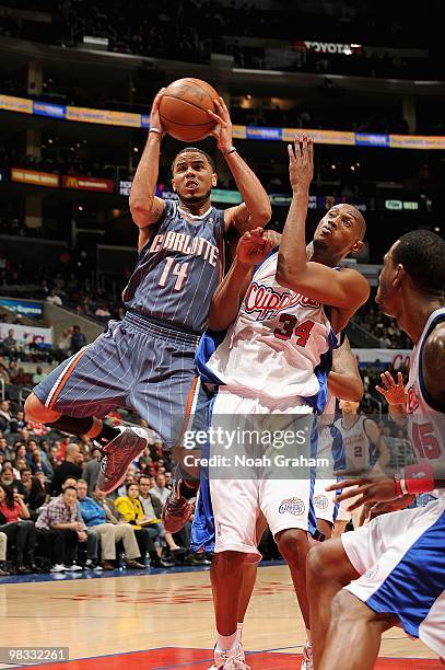 Augustin of the Charlotte Bobcats goes up for a shot against Travis Outlaw of the Los Angeles Clippers during the game on February 22, 2010 at...