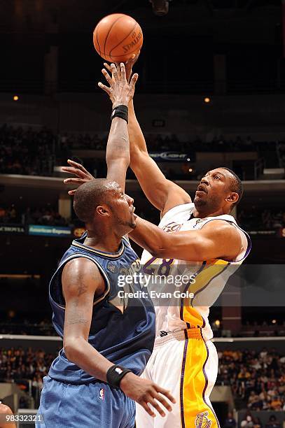 Mbenga of the Los Angeles Lakers puts up a shot against Andray Blatche of the Washington Wizards during the game on March 21, 2010 at Staples Center...