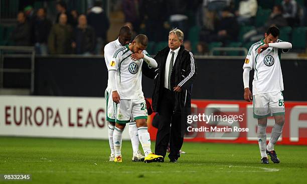 Grafite, Ashkan Dejagah, head coach Lorenz Guenther Koestner and Rever of Wolfsburg look dejected after the UEFA Europa League quarter final second...