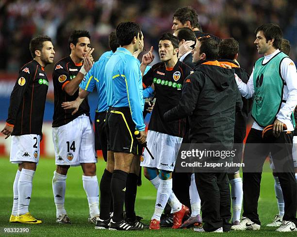 David Villa of Valencia argues with the referee at the end of the UEFA Europa League quarter final second leg match between Atletico Madrid and...