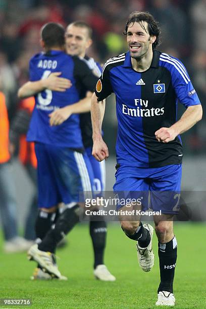 Dennis Aogo, Mladen Petric and Ruud van Nistelrooy of Hamburg celebrate the 3:1 victory after the UEFA Europa League quarter final second leg match...