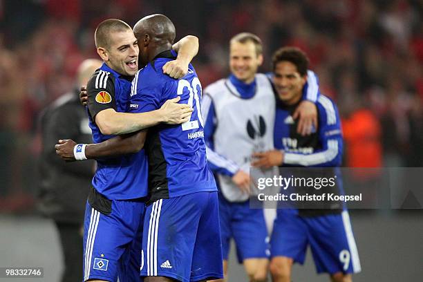 Mladen Petric of Hamburg and Guy Demel celebrate the 3:1 victory after the UEFA Europa League quarter final second leg match between Standard Liege...