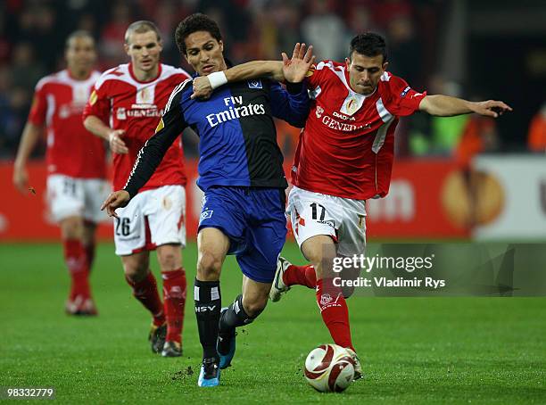 Paolo Guerrero of Hamburg and Marcos Camozzato of Liege battle for the ball during the UEFA Europa League quarter final second leg match between...