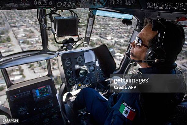 Pilot of the Mexican Police overflies Ciudad Juarez on helicopter, on April 8, 2010. Ciudad Juarez, with 1.3 million inhabitants, is the most violent...