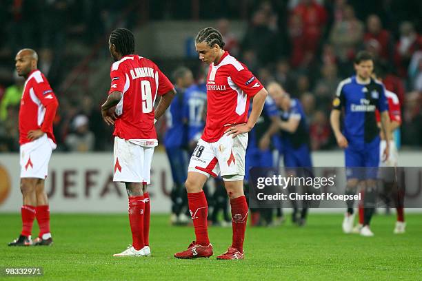 Wilfried Dalmat, Dieudonné Mbokani and Axel Witsel look dejected after losing 1-3 the UEFA Europa League quarter final second leg match between...