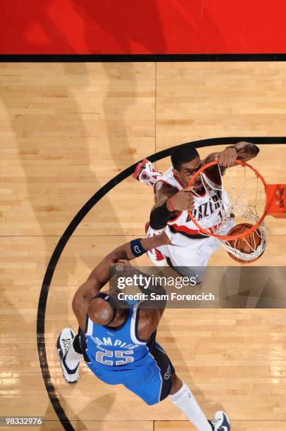 LaMarcus Aldridge of the Portland Trail Blazers dunks against Erick Dampier of the Dallas Mavericks during the game at The Rose Garden on March 25,...