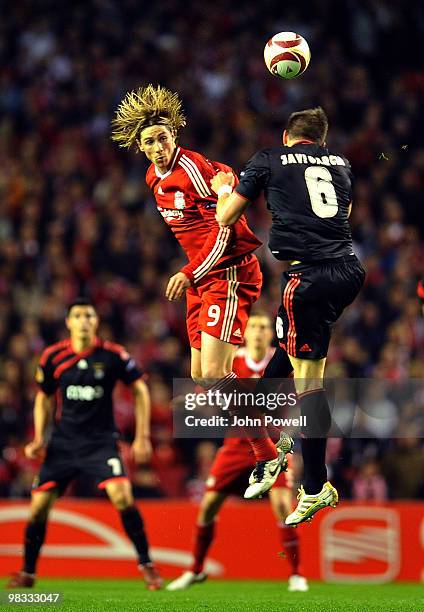 Fernando Torres of Liverpool goes up with Javi Garcia of Benfica during the quarter final second leg UEFA Europa League match between Liverpool and...