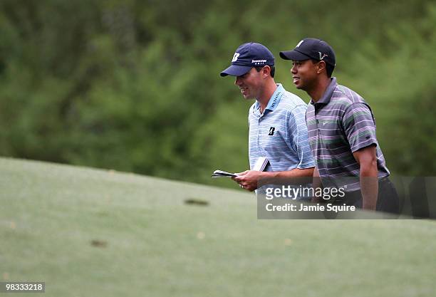 Tiger Woods walks with Matt Kuchar up to the 12th tee during the first round of the 2010 Masters Tournament at Augusta National Golf Club on April 8,...