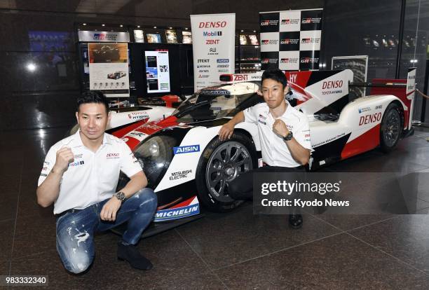 Kazuki Nakajima , who won the 24 Hours of Le Mans race in a Toyota Motor Corp. Vehicle, and runner-up Kamui Kobayashi, who also drove a Toyota, pose...