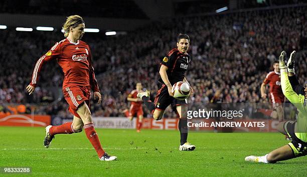 Liverpool's Spanish forward Fernando Torres scores the fourth goal during their UEFA Europa League Quarter Final Second Leg football match against...