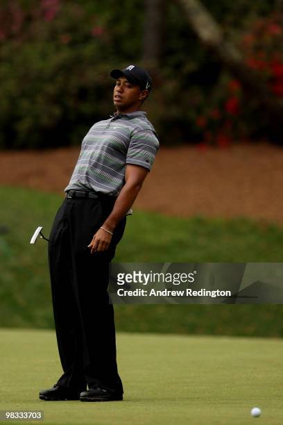 Tiger Woods reacts to missing an eagle putt on the 13th hole during the first round of the 2010 Masters Tournament at Augusta National Golf Club on...