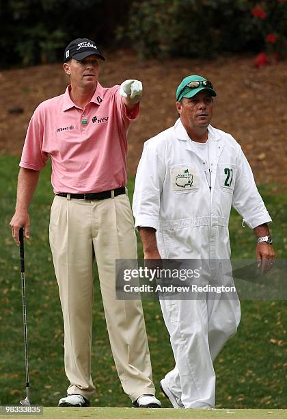 Steve Stricker waits with his caddie Jimmy Johnson on the 13th hole during the first round of the 2010 Masters Tournament at Augusta National Golf...