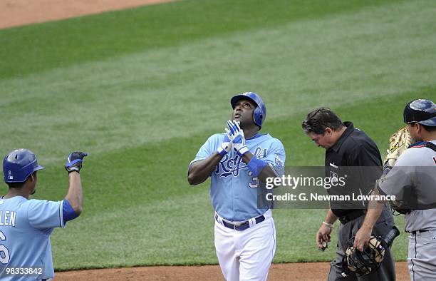 Yuniesky Betancourt of the Kansas City Royals celebrates as he crosses home plate during the season opener game against the Detroit Tigers on April...