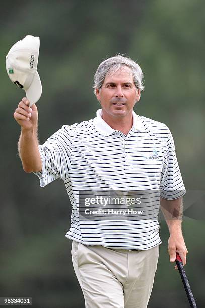 Fred Couples walks off the 18th green after a six-under par 66 during the first round of the 2010 Masters Tournament at Augusta National Golf Club on...