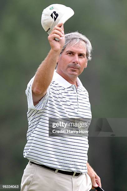 Fred Couples walks off the 18th green after a six-under par 66 during the first round of the 2010 Masters Tournament at Augusta National Golf Club on...