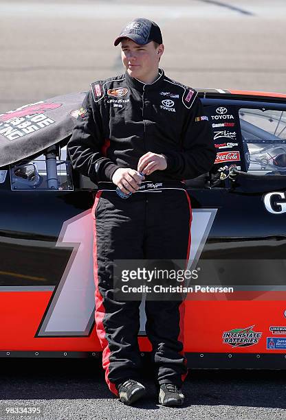 Brett Moffitt driver of the Game Plan for Life Toyota stands next to his car during qualifying for the Jimmie Johnson Foundation 100 NASCAR K&N Pro...