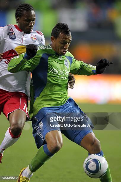 Tyrone Marshall of the Seattle Sounders FC protects the ball from Macoumba Kandji of the New York Red Bulls during their MLS match on April 3, 2010...
