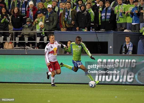 Steve Zakuani of the Seattle Sounders FC paces the ball on the attack against Seth Stammler of the New York Red Bulls during their MLS match on April...