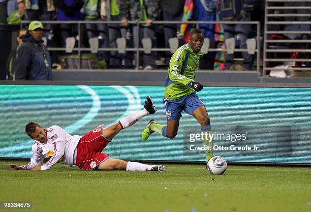 Steve Zakuani of the Seattle Sounders FC paces the ball on the attack against Seth Stammler of the New York Red Bulls during their MLS match on April...
