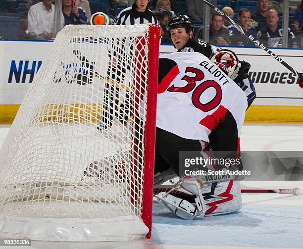 Martin St. Louis of the Tampa Bay Lightning scores a goal against goaltender Brian Elliott of the Ottawa Senators during the first period at the St....
