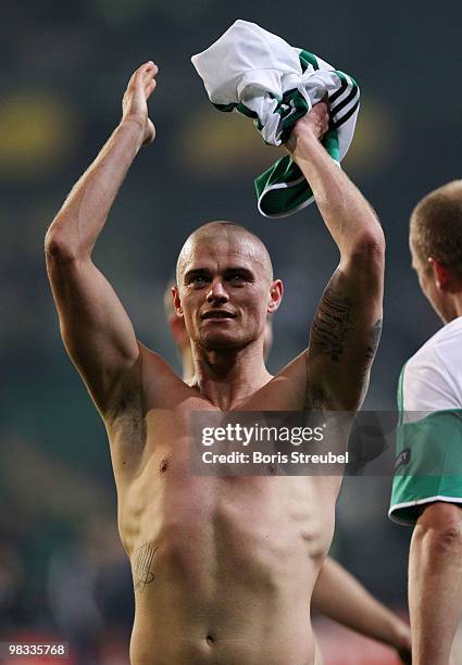 Paul Konchesky of Fulham celebrates after winning the UEFA Europa League quarter final second leg match between VfL Wolfsburg and Fulham at...