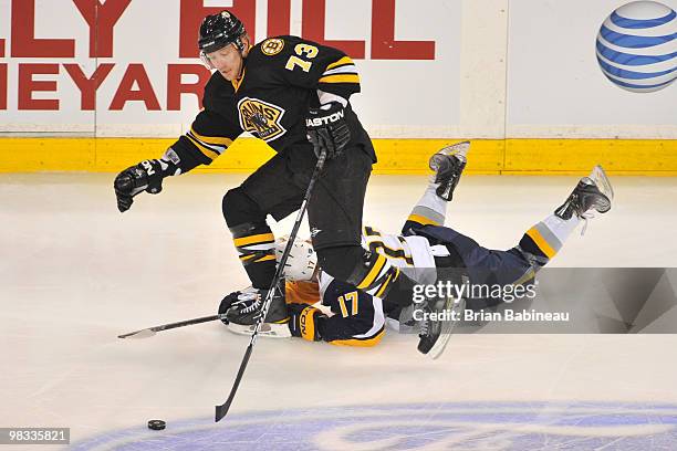 Michael Ryder of the Boston Bruins skates with the puck against Raffi Torres of the Buffalo Sabres at the TD Garden on April 8, 2010 in Boston,...