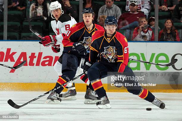 Michael Frolik of the Florida Panthers skates with the puck against the New Jersey Devils at the BankAtlantic Center on April 8, 2010 in Sunrise,...