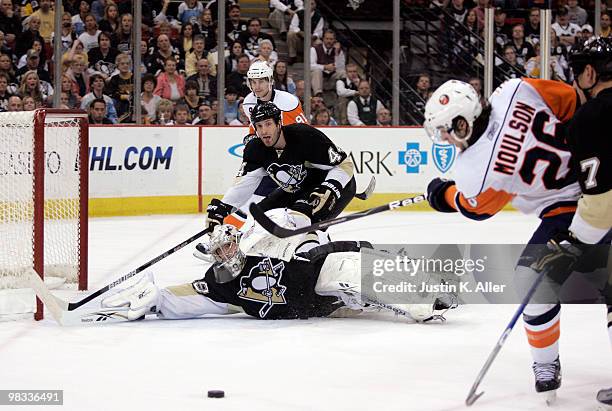 Marc-Andre Fleury of the Pittsburgh Penguins makes a save on Matt Moulson of the New York Islanders in the second period at Mellon Arena on April 8,...