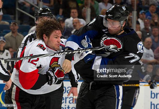 Victor Hedman of the Tampa Bay Lightning fights against Mike Fisher of the Ottawa Senators during the second period at the St. Pete Times Forum on...