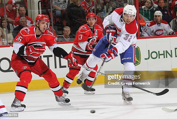 Brandon Sutter of the Carolina Hurricanes attempts to block Travis Moen of the Montreal Canadiens during a NHL game on April 8, 2010 at RBC Center in...