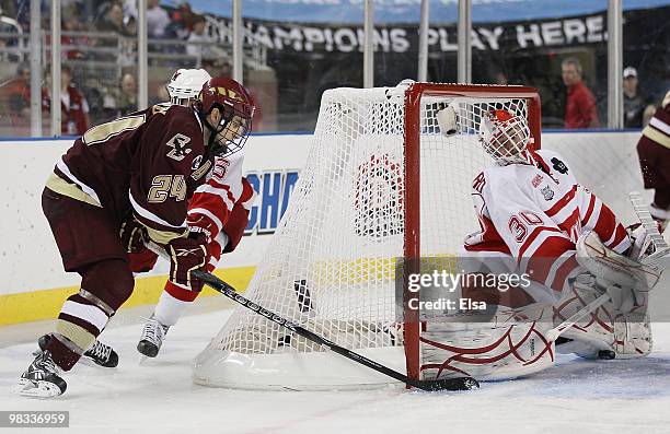 Matt Lombardi of the Boston College Eagles tries to get one past Cody Reichard of the Miami Redhawks on April 8, 2010 during the semifinals of the...