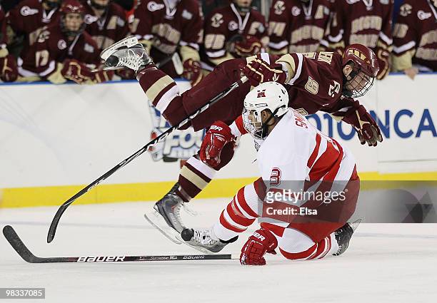 Brandon Smith of the Miami Redhawks flips Barry Almeida of the Boston College Eagles on April 8, 2010 during the semifinals of the 2010 NCAA Frozen...