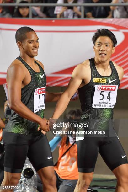 Ryota Yamagata shakes hands with Aska Cambridge after winning the Men's 100m final on day two of the 102nd JAAF Athletic Championships at Ishin...