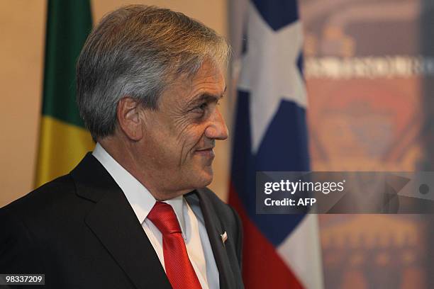 Chile's President Sebastian Pinera listens to a speech after having been decorated with an honour medal by Paulo Skaf , chairman of Sao Paulo's State...