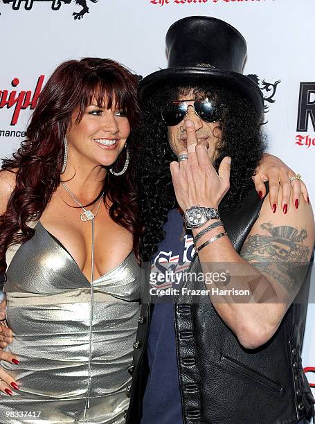 Perla Ferrar and musician Slash arrive at the 2nd annual Revolver Golden Gods Awards held at Club Nokia on April 8, 2010 in Los Angeles, California.