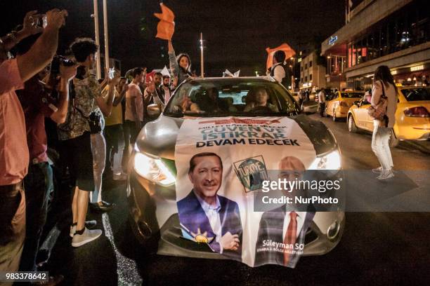 Supporters of Recep Tayyip Erdogan, candidate of the Justice and Development Party, celebrate his victory in presidential elections in Taksim square,...