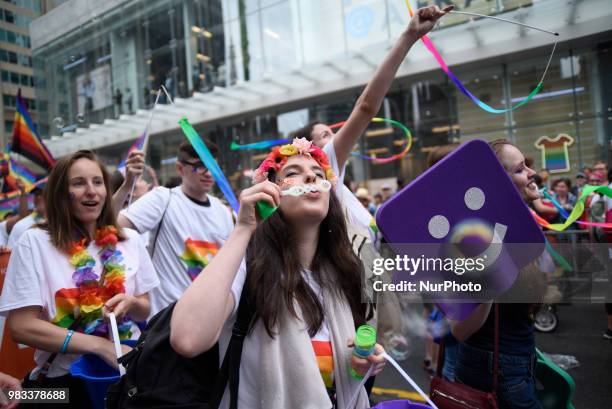 People lined the sidewalks along Yonge Street to witness the Annual Pride Parade on a rainy and wet day in Toronto, Canada, on June 24, 2018